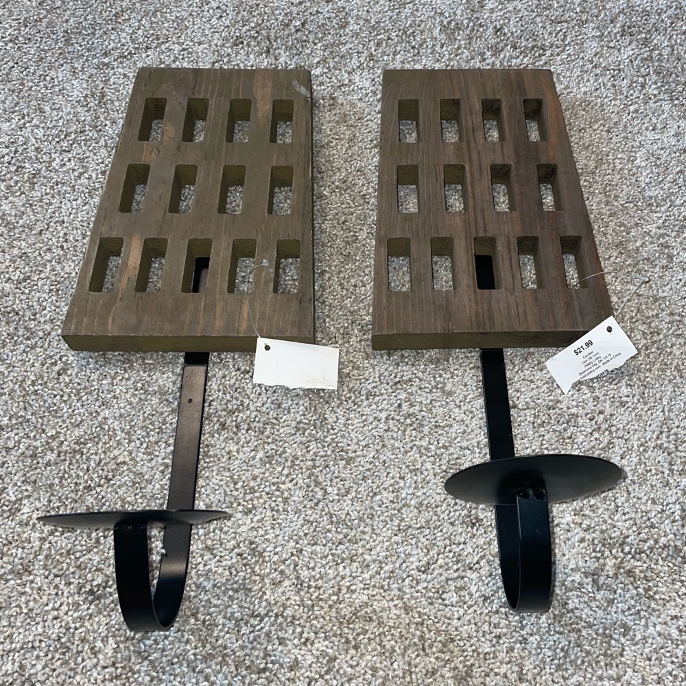 Wooden Wall sconces with Black Metal Candle holder attached.